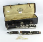 A Bb clarinet by F. Buisson, Paris, in a vintage leather box