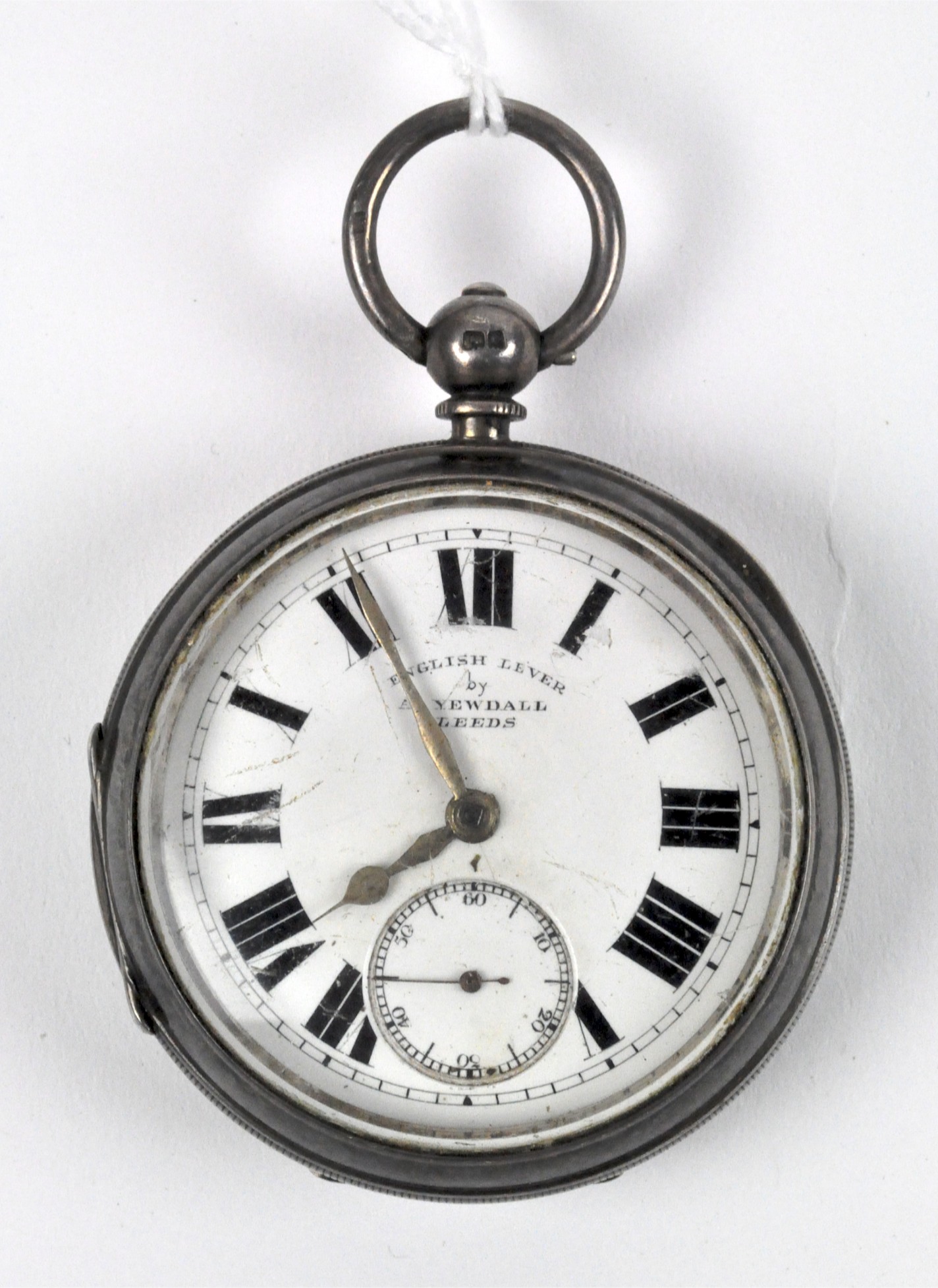 An Edwardian silver open faced pocket watch, retailed as English Lever by A Yewdall, Leeds,