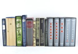 A selection of 'The Folio Society' books, including 'The Deceivers' set by Thaddeus Holt,