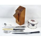 A round plated biscuit box with hinged lid together with some flatware and a wood knife block