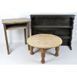 A dark stained dresser top together with a round pine coffee table and an oak school desk