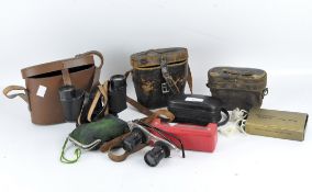 A group of binoculars including vintage pairs, one marked Maison de L'ingenieur Chevalier, cased,