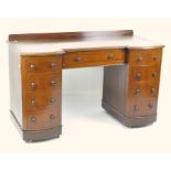 A 19th century mahogany desk, a long drawer to the centre with four drawers to either side,
