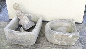 Two stone troughs together with a garden figure