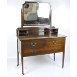 A Victorian mahogany dressing table with mirror,