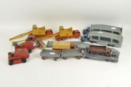 A collection of Dinky industrial vehicles, including two Pullmore Car Transporters 982,