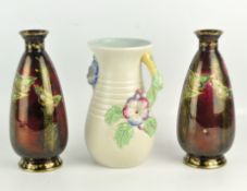 A Clarice Cliff 'My Garden' jug ogether with a pair of Devon Fieldings Sylvan Lustrine vases