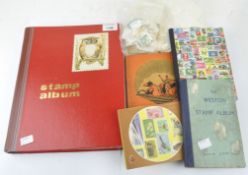 A selection of stamps, spread over five albums and loose, comprising GB and rest of the World,