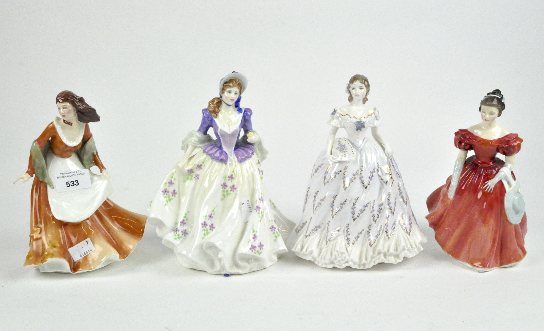 Four Royal Doulton figures of ladies