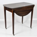 A Victorian mahogany oval Pembroke table with two D shaped leaves,