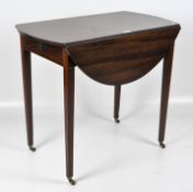 A Victorian mahogany oval Pembroke table with two D shaped leaves,