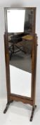 A 20th century Cheval mirror, with mahogany frame and splayed supports, height 150cm.