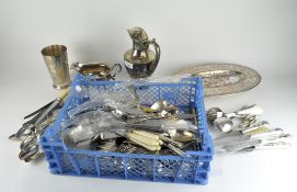 A selection of silver plate, including flatware, a beaker,