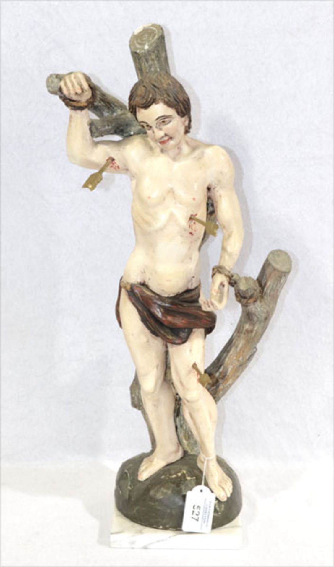 Holz Figurenskulptur 'Hl. Sebastian', farbig gefaßt, Farbablösungen, auf Marmorplatte, H 54 cm,