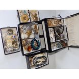 A black jewellery case and contents.