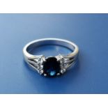 A modern sapphire & diamond set 14ct white gold ring. Finger size L.