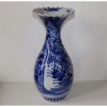 A Japanese blue & white porcelain vase with narrow neck and fluted rim, 14.75" high.