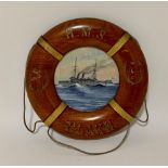 A circular watercolour ship's portrait of HMS Blake, 9" diameter, in painted wooden lifebuoy