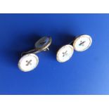 A pair of mother-of-pearl set circular gold cufflinks - 9ct.