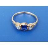 A small 19thC sapphire & diamond set three stone gold ring - tests as 18ct gold. Finger size M/N.