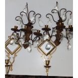 A pair of gilt metal triple candle branch appliques with large lustre drops, 13" high and one