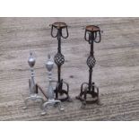 A pair of wrought iron pricket candlesticks on lion paw feet, 24" high and a pair of andirons. (4)