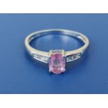 A modern pink sapphire & diamond ring in 9ct white gold. Finger size N.