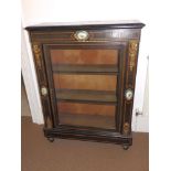 A Victorian ormolu mounted ebonised pier cabinet , inlaid with stringing and set with three small