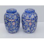 A small pair of 20thC Chinese porcelain ginger decorated in black printed hawthorn pattern on blue