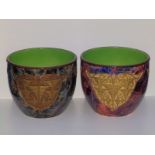 A pair of Jugendstil style continental earthenware jardinieres, decorated in differing colourways