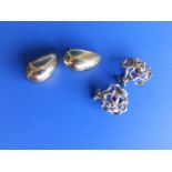 A pair of 9ct gold openwork clip on earrings and one other pair. (4)