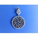 A rose cut diamond pendant, of openwork design including numerous collet set stones, a small pear-