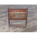 An Arts & Crafts oak magazine rack applied with embossed copper panel - 'A Place For Everything',