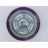 A 19thC Sevres porcelain cabinet plate in the neoclassical style, painted in polychrome with a