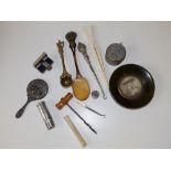 An art nouveau tortoiseshell spoon, a miniature mouth organ, a seal and other items.