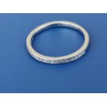 A diamond set platinum half eternity ring. Finger size N.