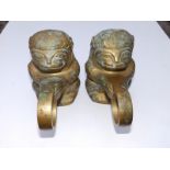 A pair of brass rowlocks fashioned as monkeys, 8.5" across.
