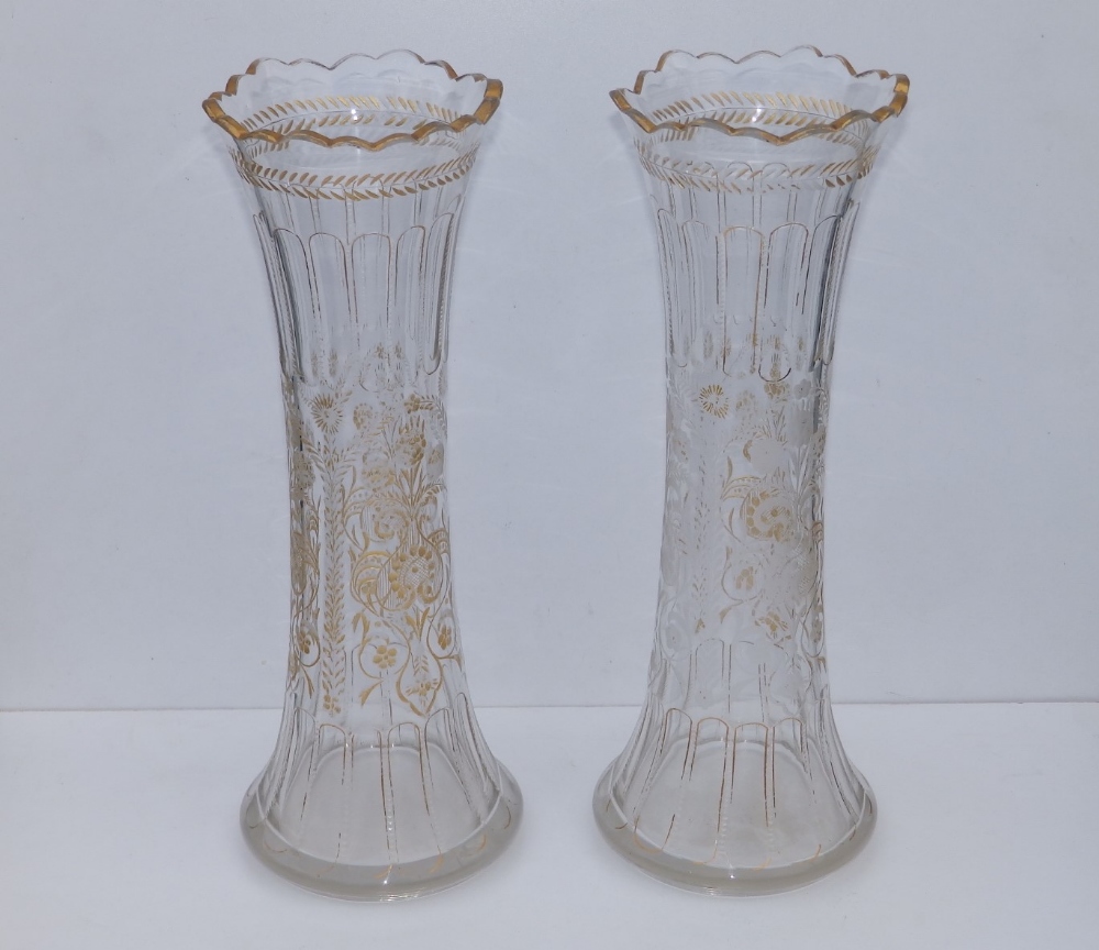 A pair of late 19thC floral engraved glass vases, of slender waisted form, 14.5" - gilding rubbed.