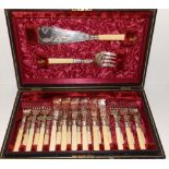 A Victorian cased 12 place set of EP fish cutlery, comprising 12 knives & forks with a pair of