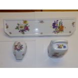 A Limoges porcelain bathroom shelf, printed in coloured flowers on white, 23.5" across, together