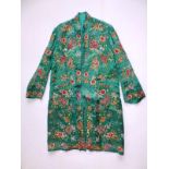 A Chinese embroidered green silk robe/jacket, profusely decorated with colourful flowers.