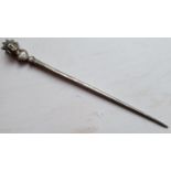 A Roman silver hair pin, the terminal modelled as a crowned bust, previously in the collection of