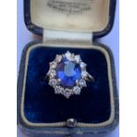 A certified natural colour change Sri-Lankan sapphire & diamond cluster ring, the oval mixed cut 4