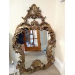 A modern reproduction gilt resin mirror in the early 18thC style, Height 48", Width 32".