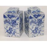 A pair of 20thC Chinese blue & white porcelain square section covered vases, decorated with warriors