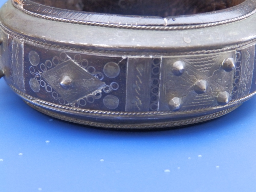 An antique lignum vitae bangle inlaid and applied with silver decoration and studding, , 3.1" - Image 4 of 4