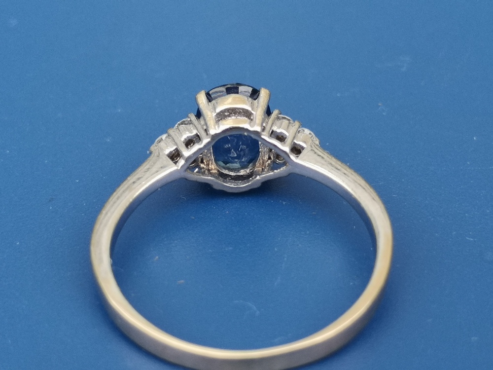 A modern sapphire & diamond set 18ct gold ring, the oval sapphire fanked by six small diamonds - ' - Image 3 of 3