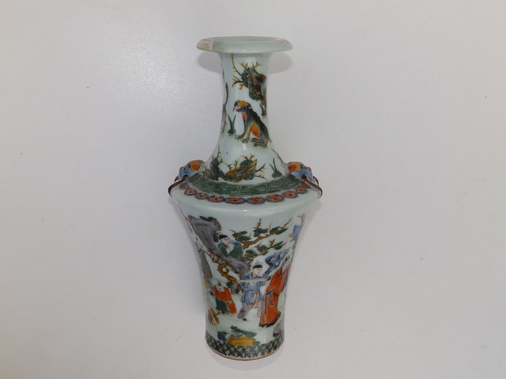 A Chinese famille verte porcelain bottle vase, having angular shoulders, decorated with an