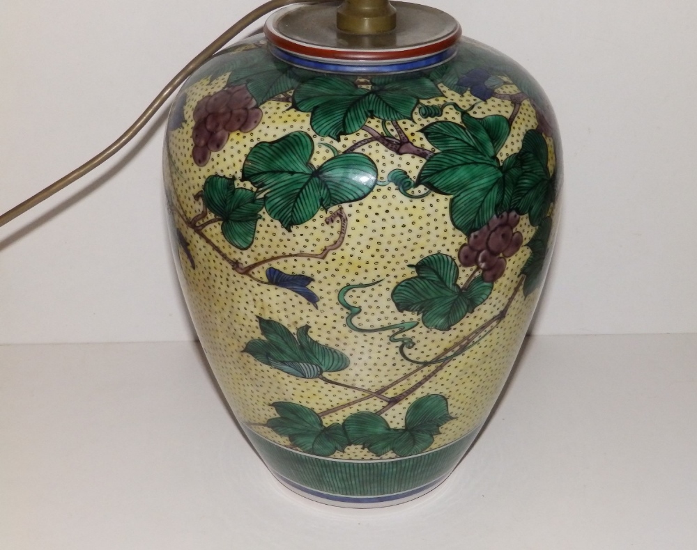 A Japanese porcelain vase, in use as a lamp, decorated grape vine foliage, green painted seal mark