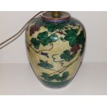 A Japanese porcelain vase, in use as a lamp, decorated grape vine foliage, green painted seal mark